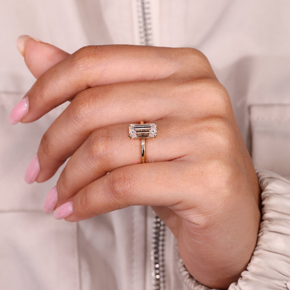 Emerald cut engagement ring with double prong setting.

