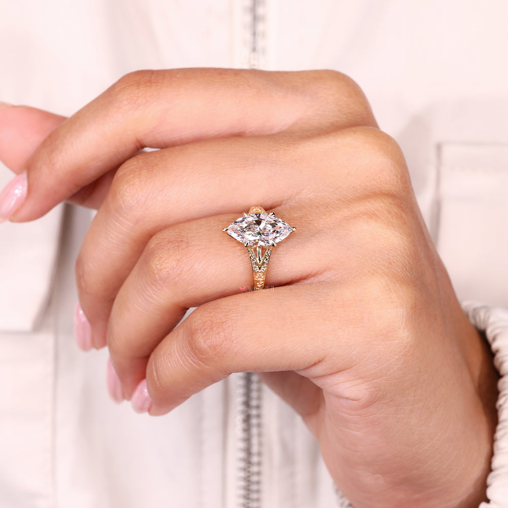 Six claw prong marquise diamond ring design.

