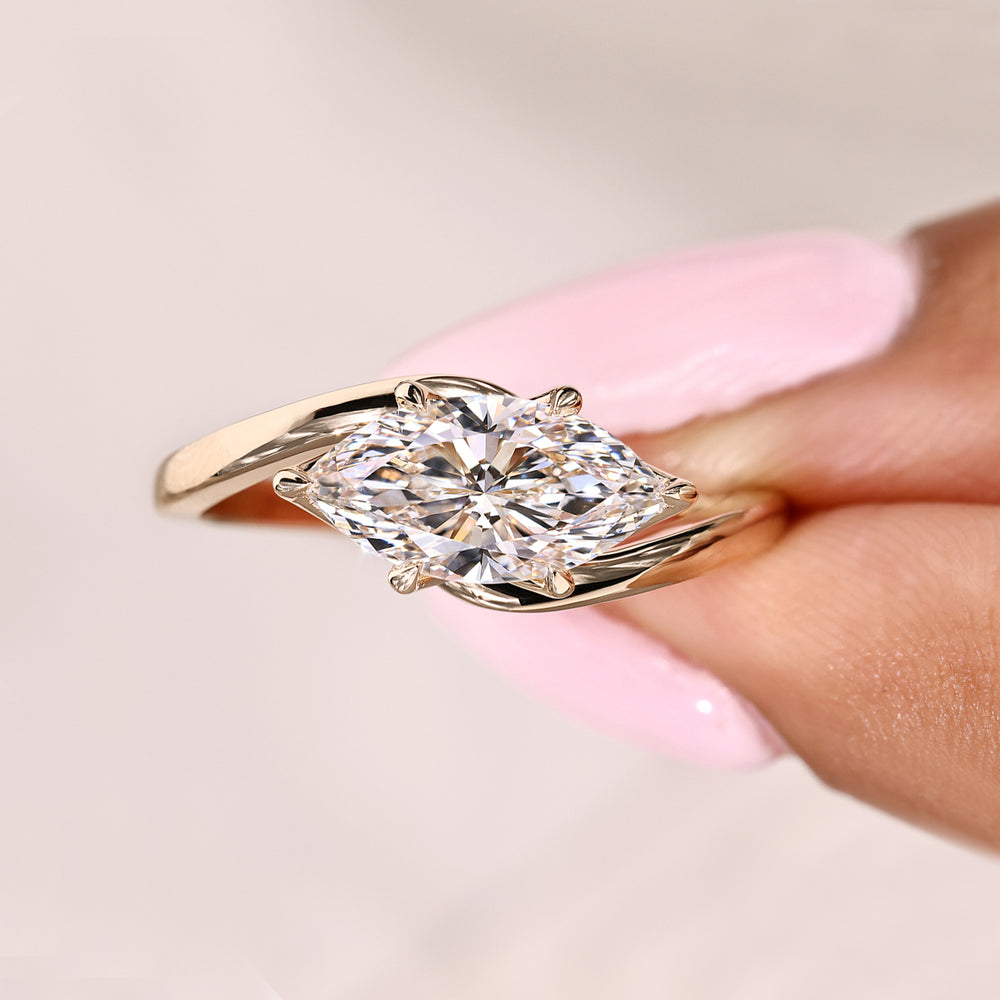 Marquise cut engagement ring with east to west setting
