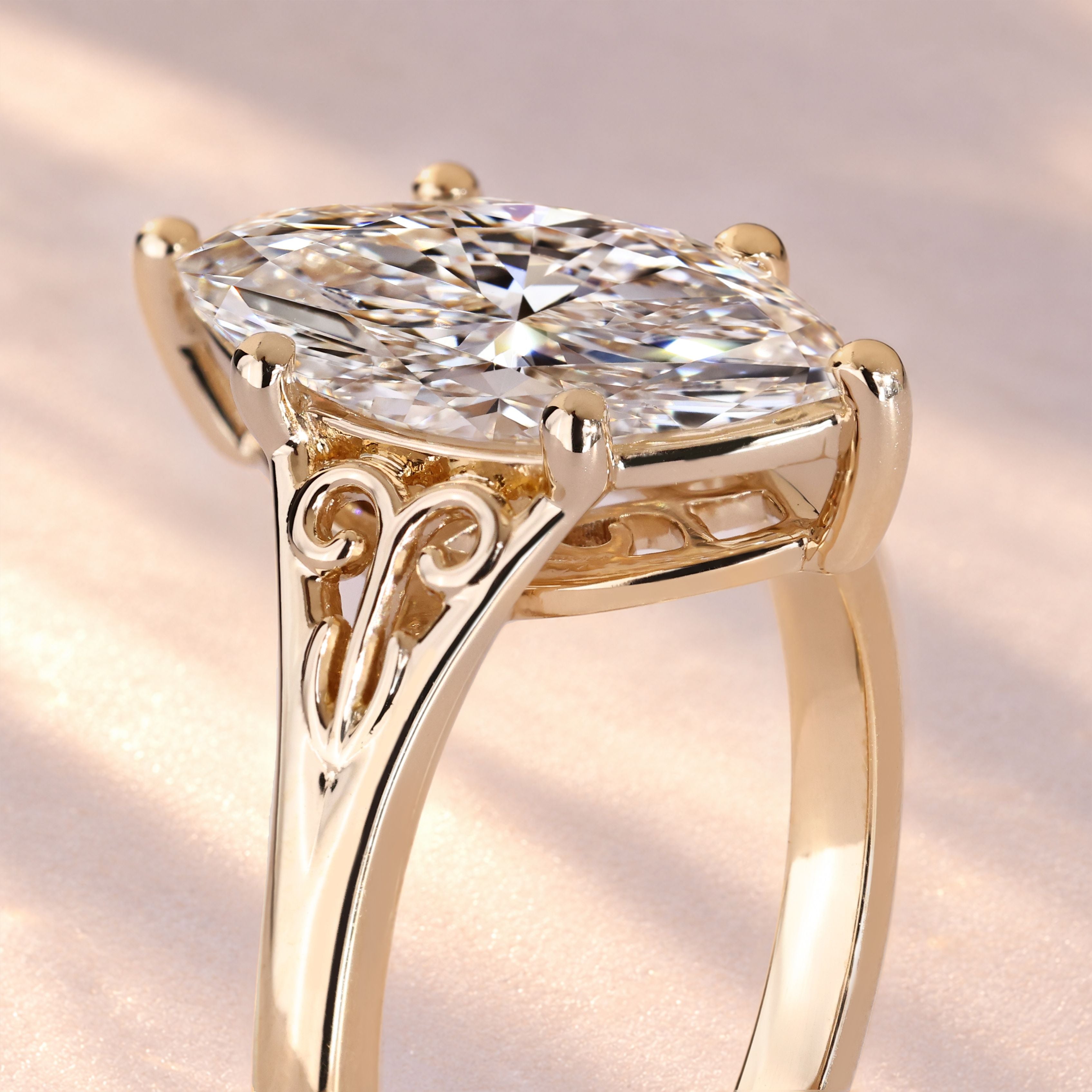 Lab grown marquise diamond ring with six prongs.
