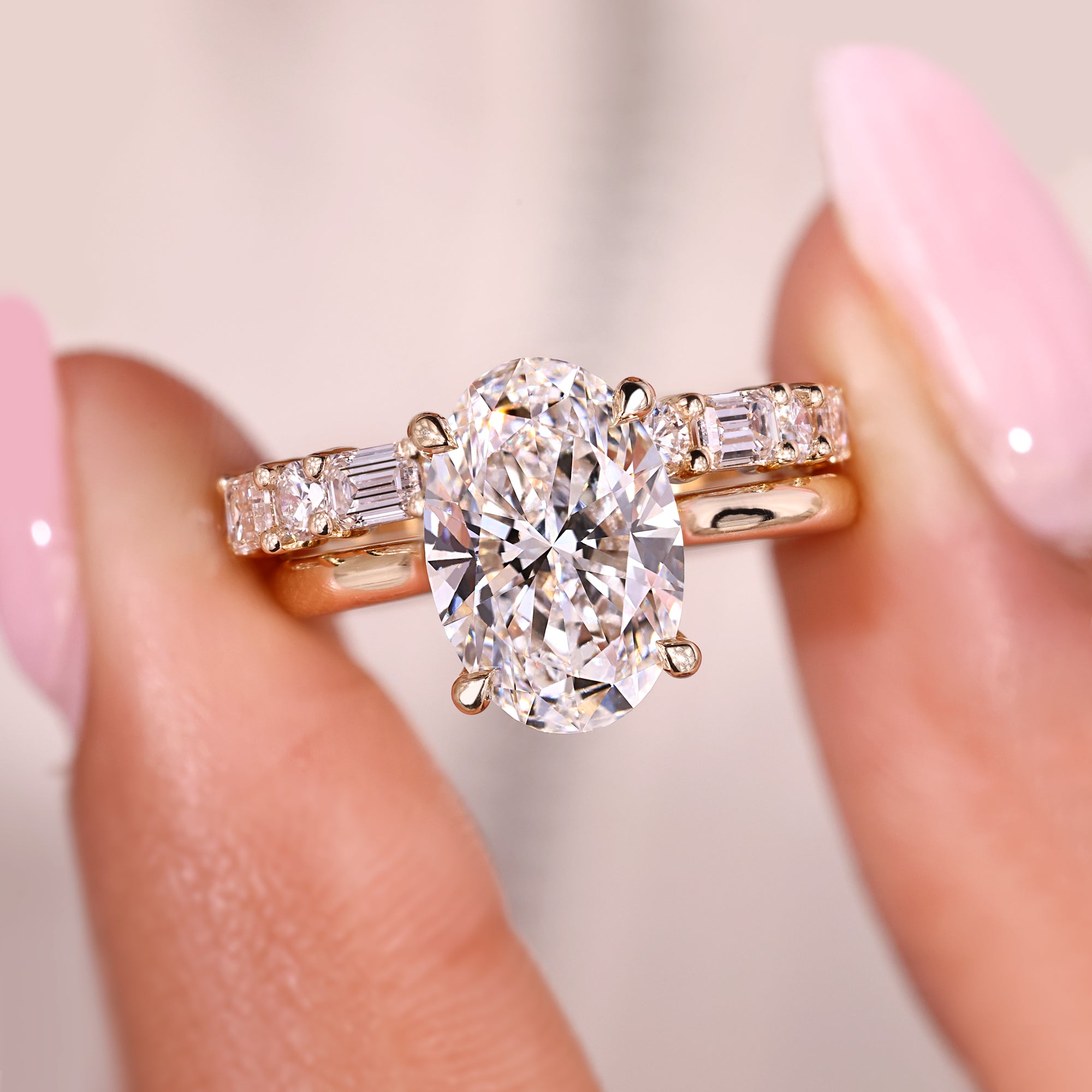Handmade oval diamond ring with solitaire and diamond band.
