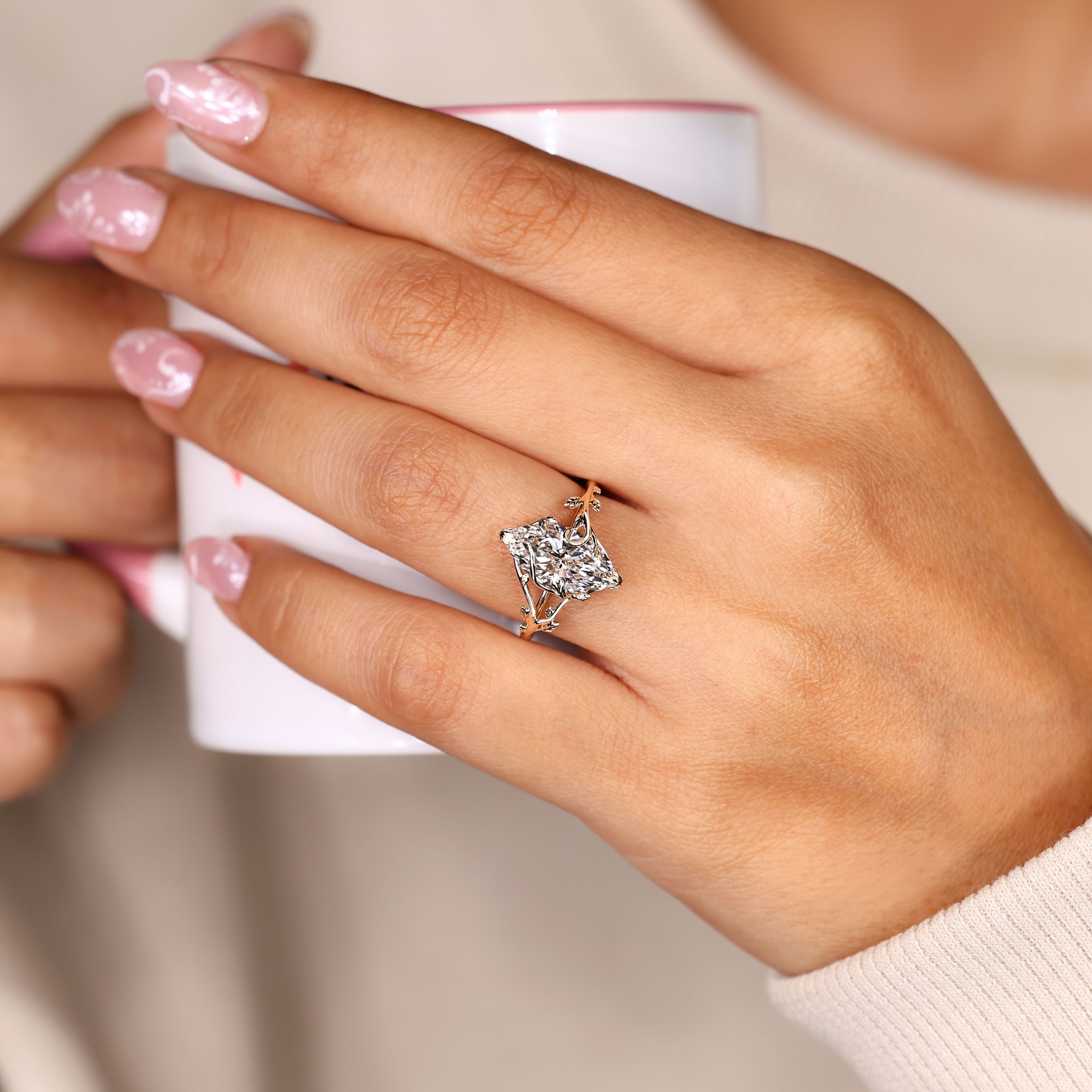 Solitaire marquise diamond ring with leaf prongs.
