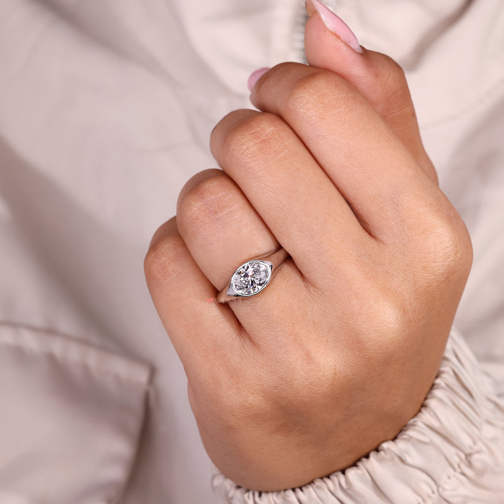 Lab grown oval cut diamond ring with tapered shank.
