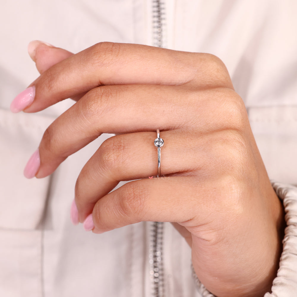 IGI certified bezel set round diamond solitaire ring.
