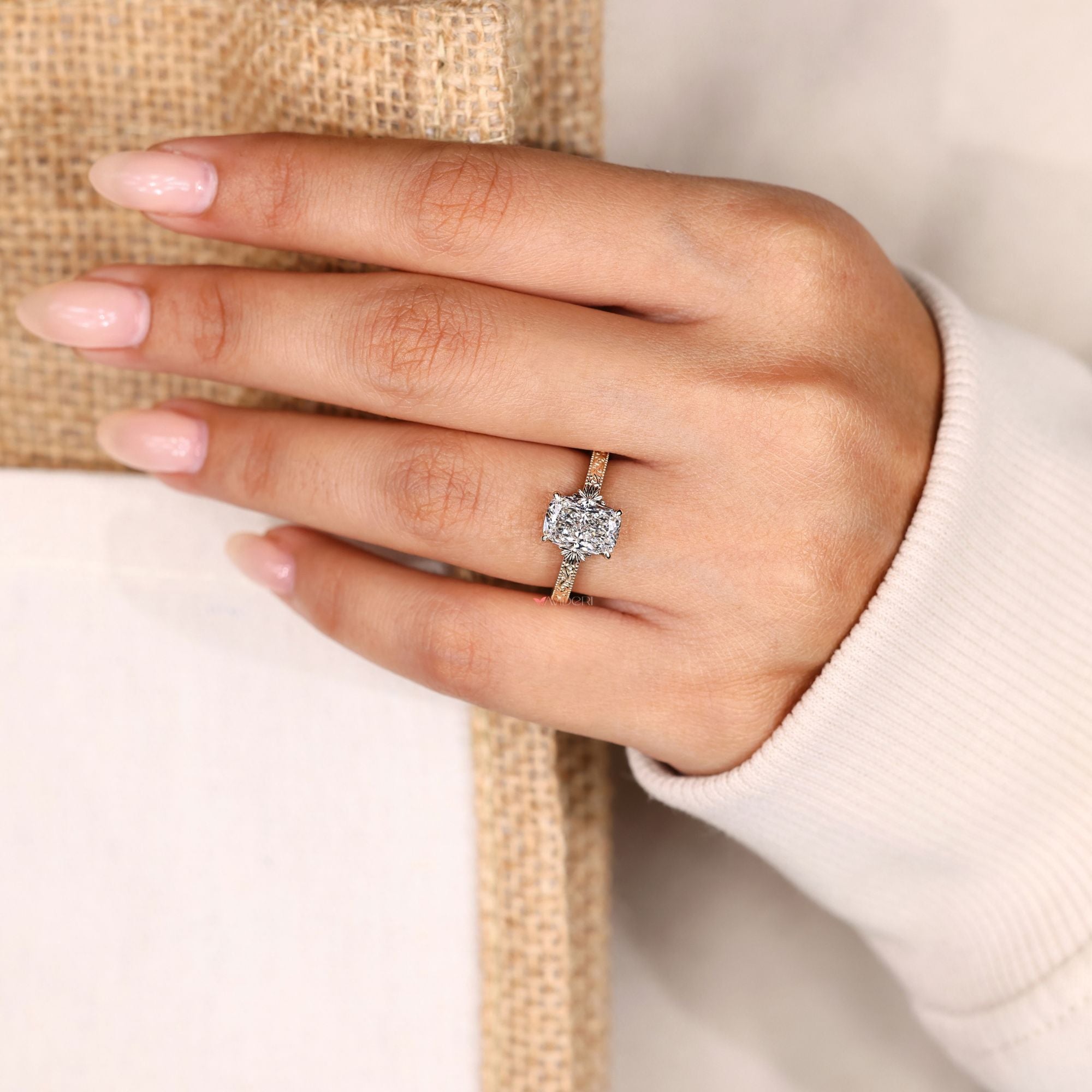 Cushion cut solitaire ring with milgrain detailing.
