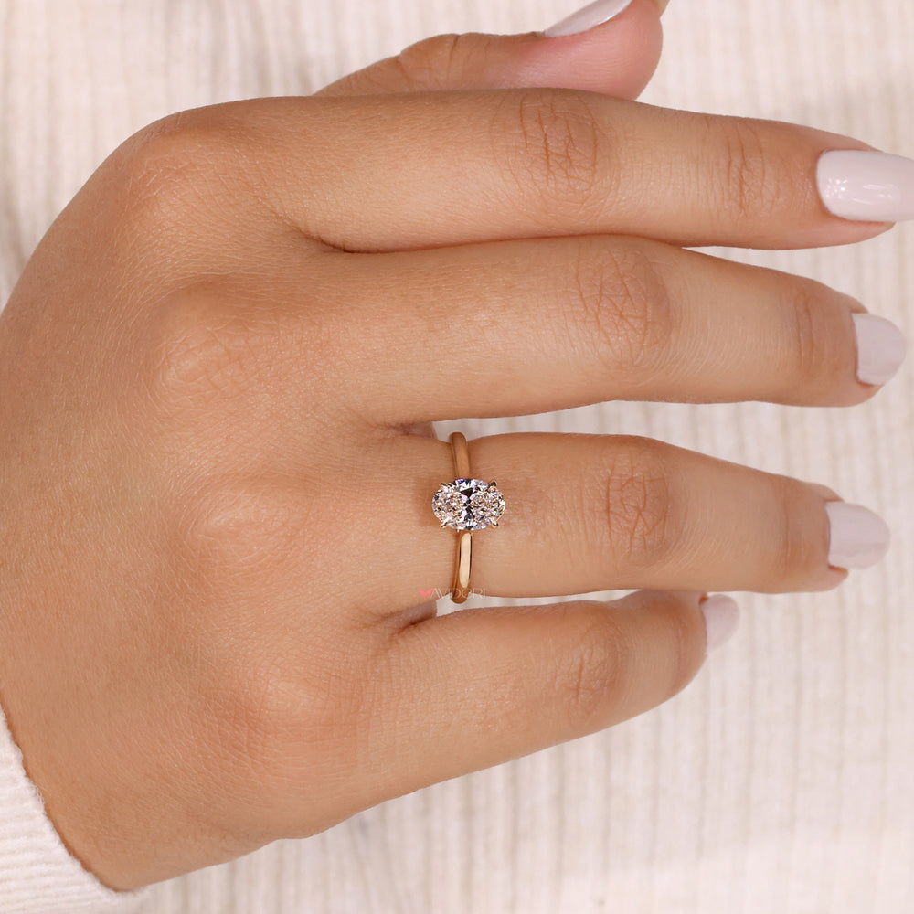 Oval solitaire engagement ring crafted with precision, highlighting the brilliance of a beautiful oval diamond.
