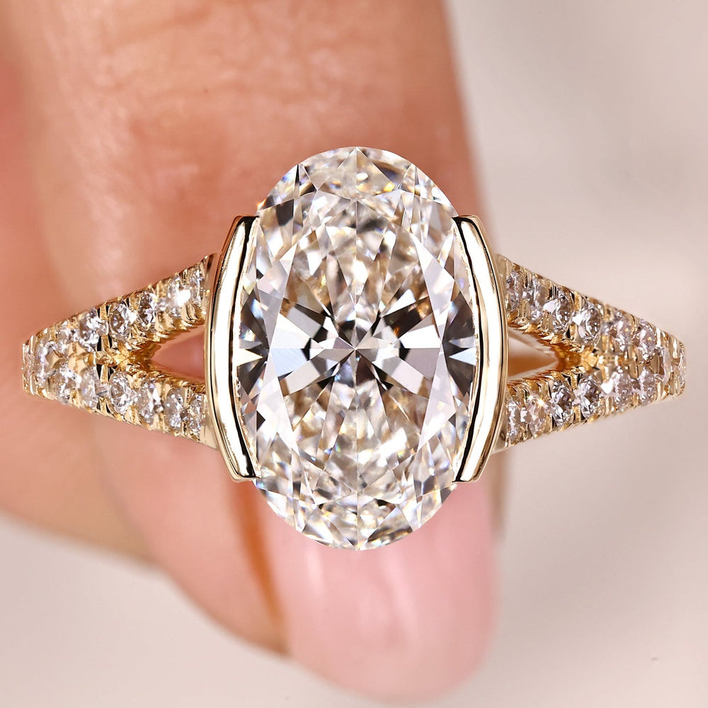 Oval diamond engagement ring with cathedral setting ring.