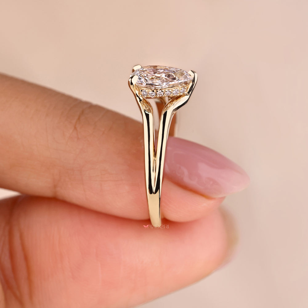 Teardrop ring with a hidden halo pear engagement ring design, ideal for those seeking classic elegance.
