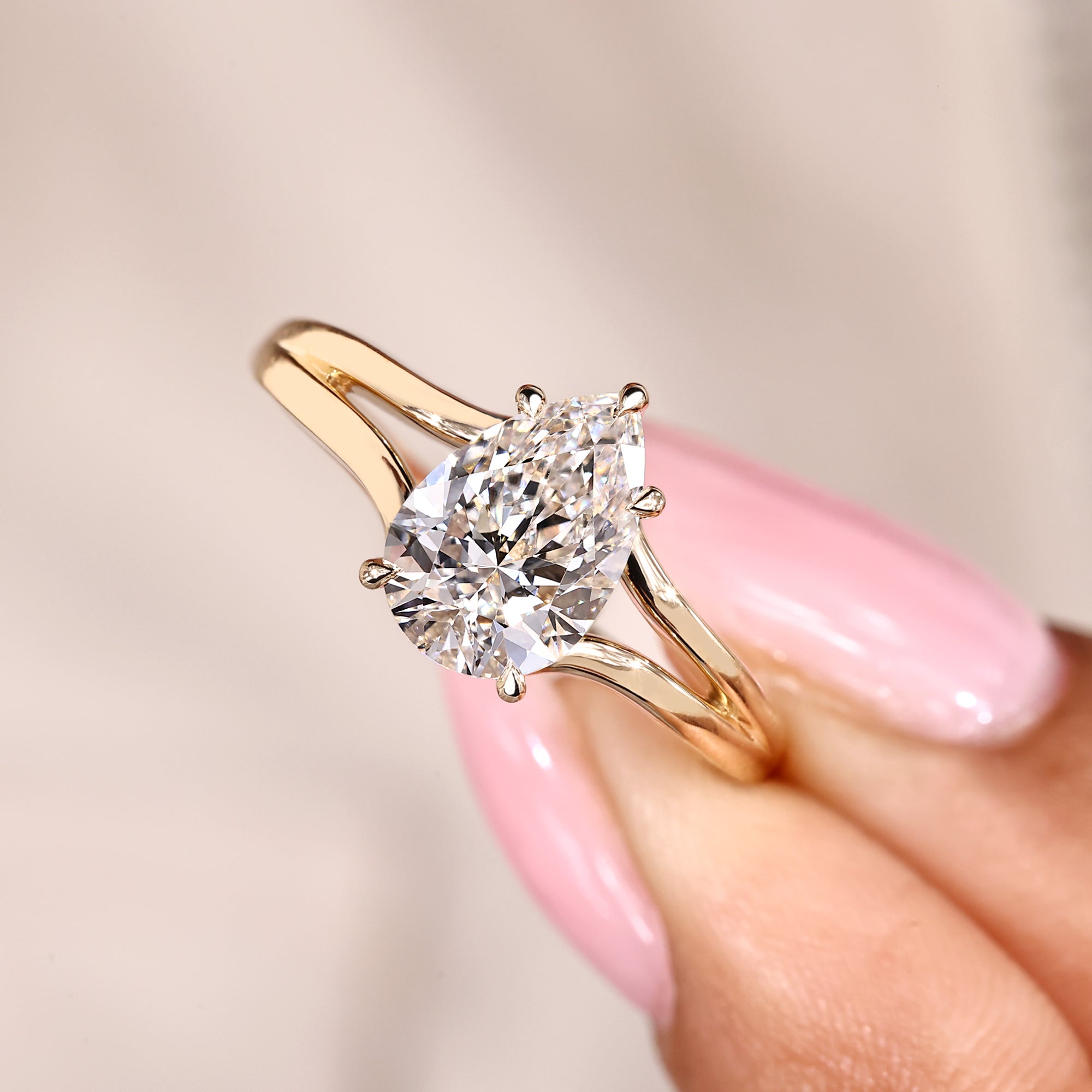 Handmade pear cut lab grown diamond ring with elegant split shank