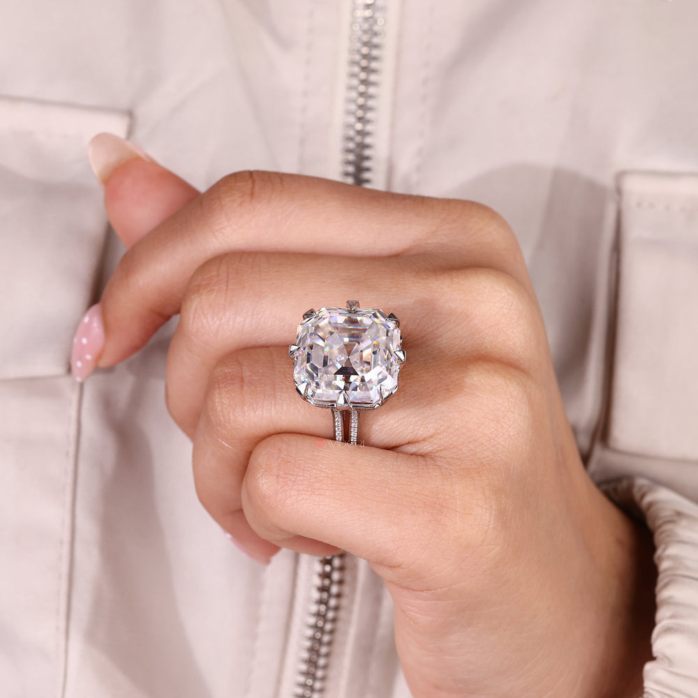 Eight claw prong Asscher cut moissanite ring.