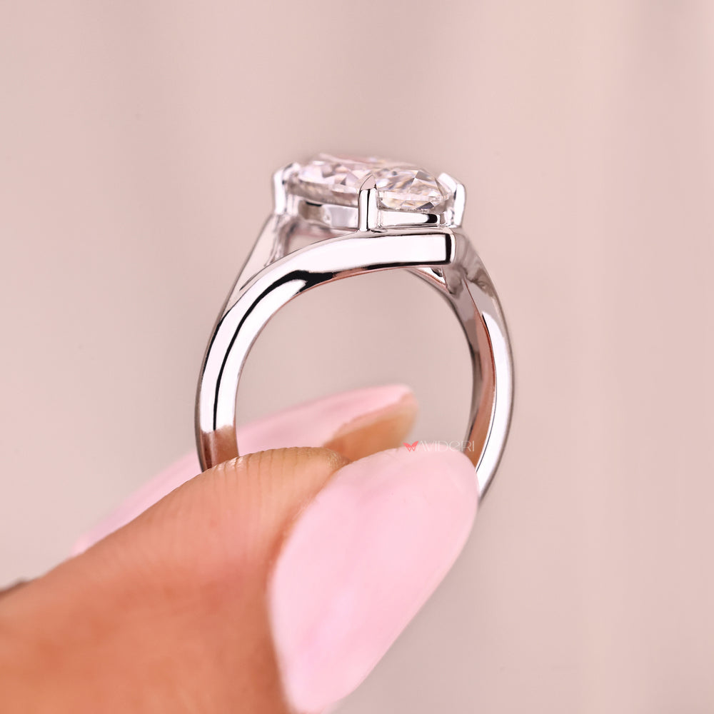 Marquise diamond engagement ring with four claw style prongs
