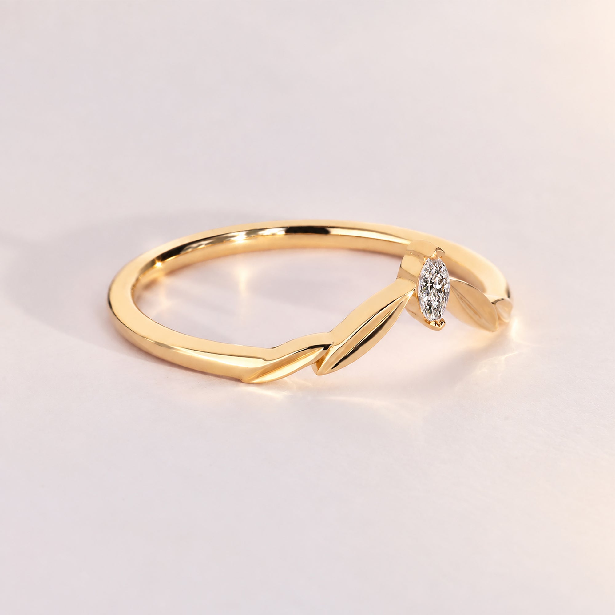 Handmade curved wedding band with marquise diamonds.
