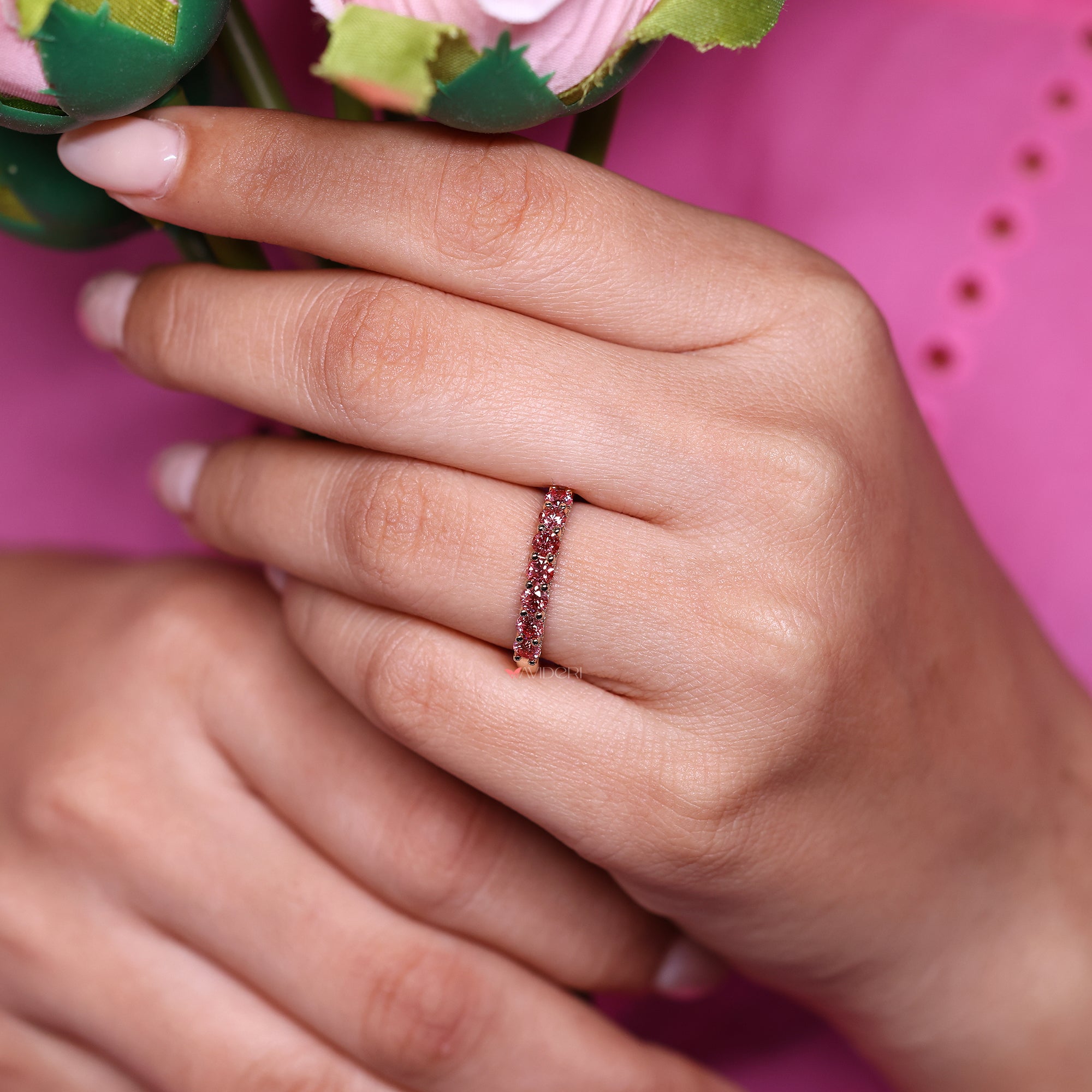 Pink diamond wedding band with round diamond wedding band.
