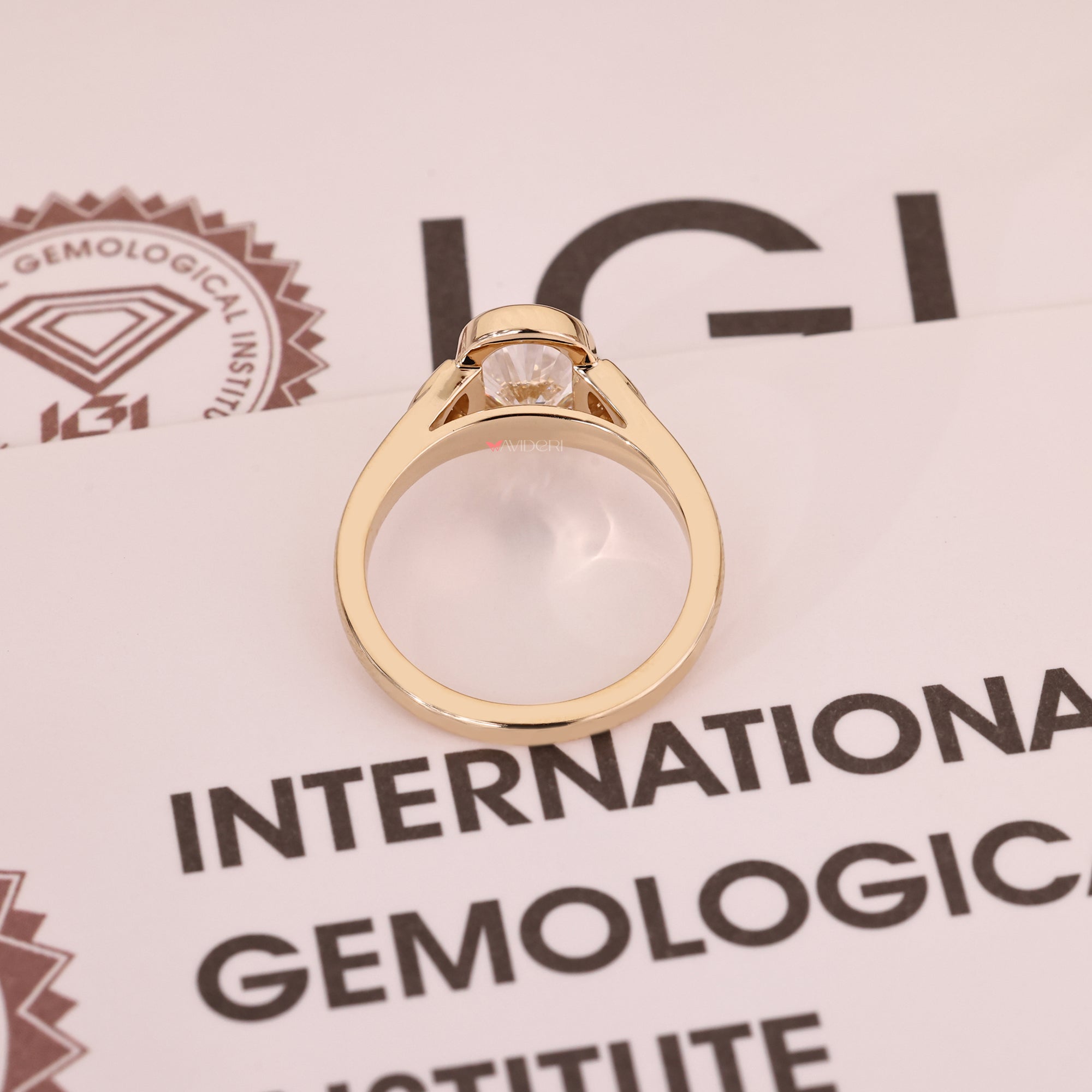 Yellow gold engagement ring with lab-grown diamond ring.