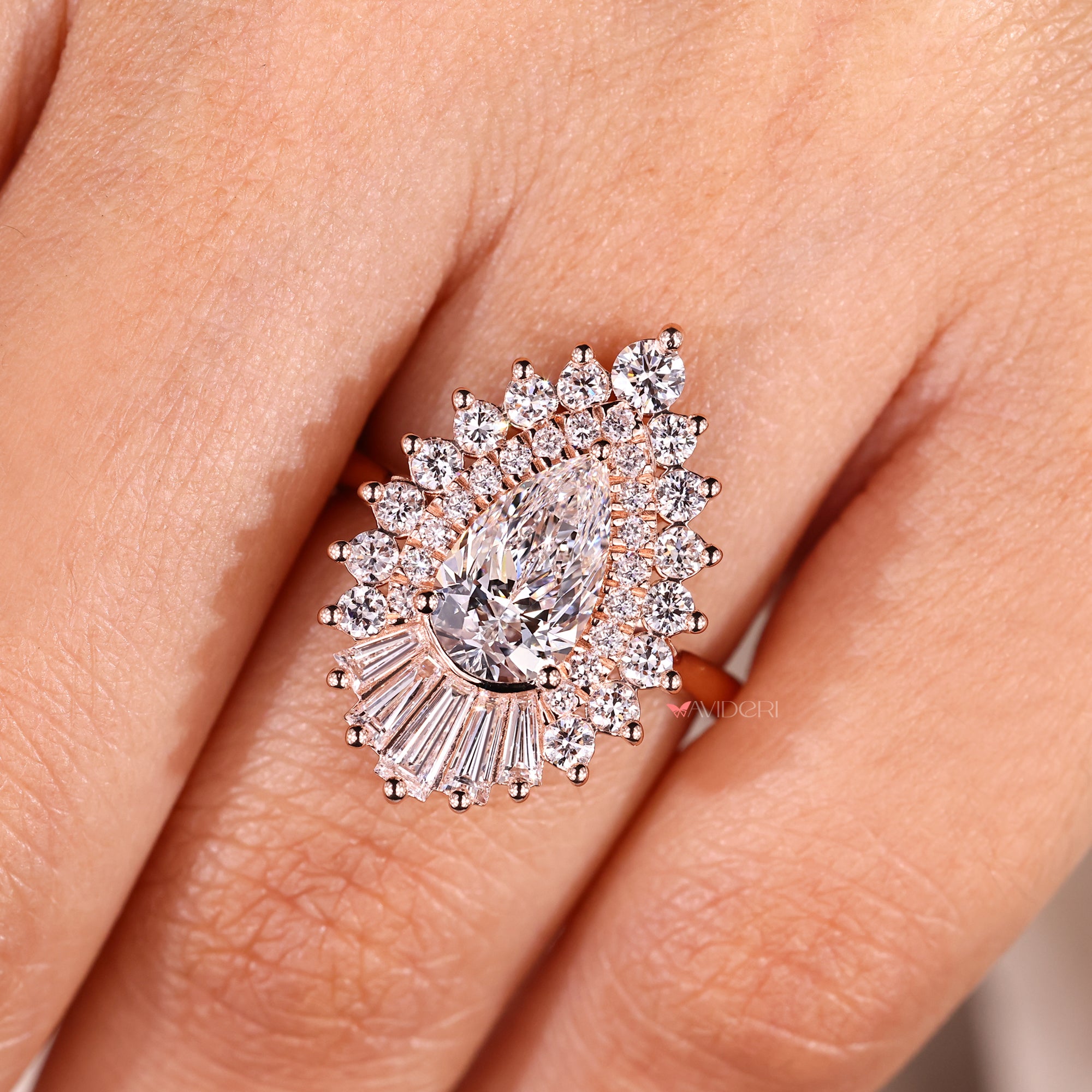 Vintage inspired pear cut diamond ring with round halo.