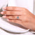 Handmade round diamond ring with hidden halo detail.
