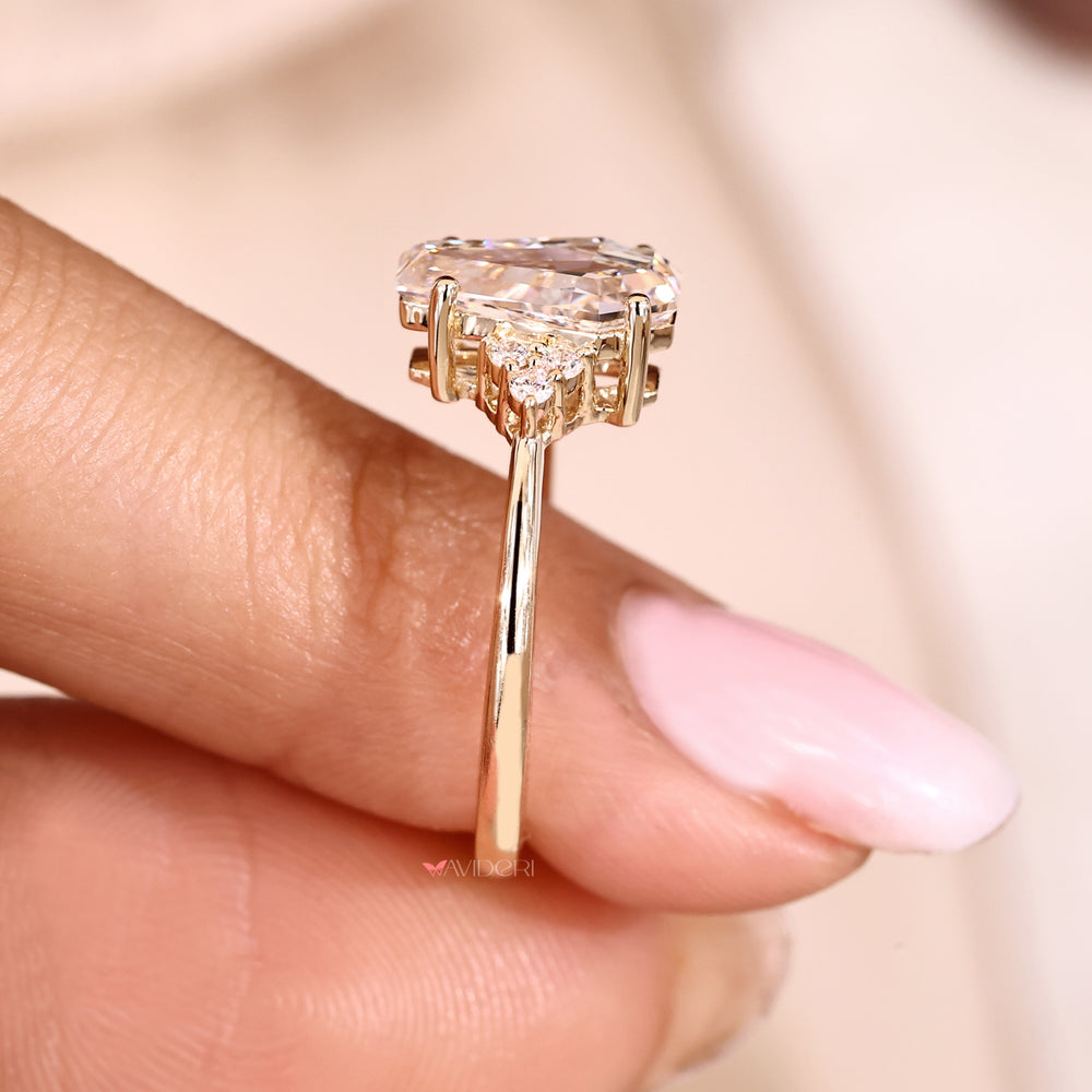 Lab grown seven stone diamond ring with four prongs.