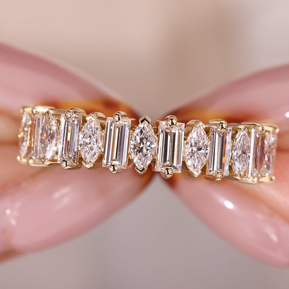 Half eternity band with marquise and baguette diamonds.
