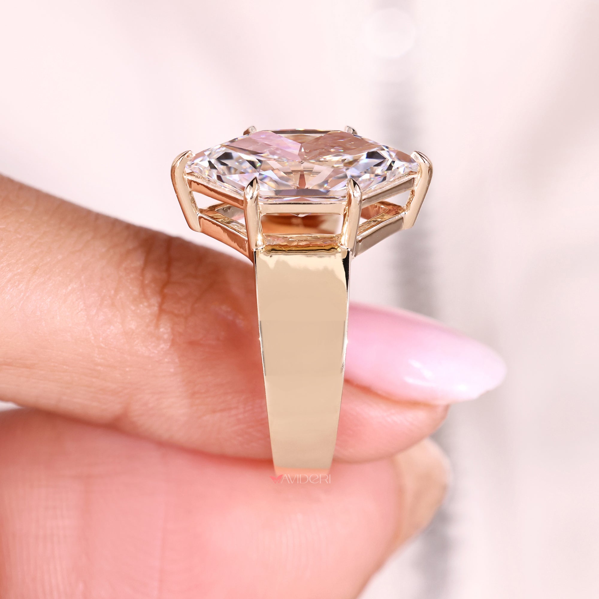 Tapered shank marquise diamond ring design.