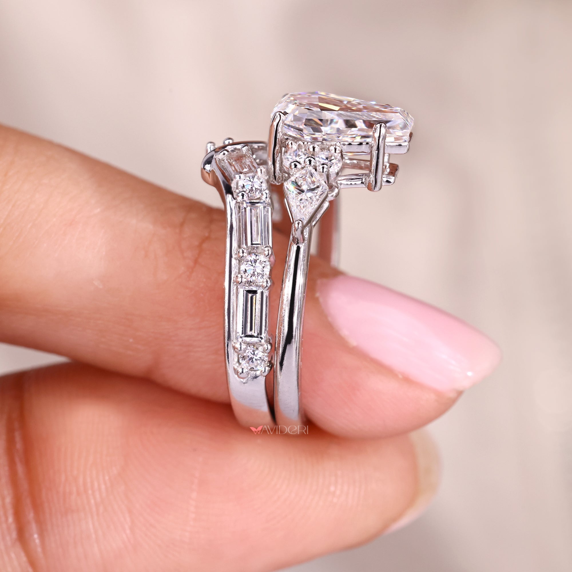 Tapered shank ring with a coffin cut center stone.