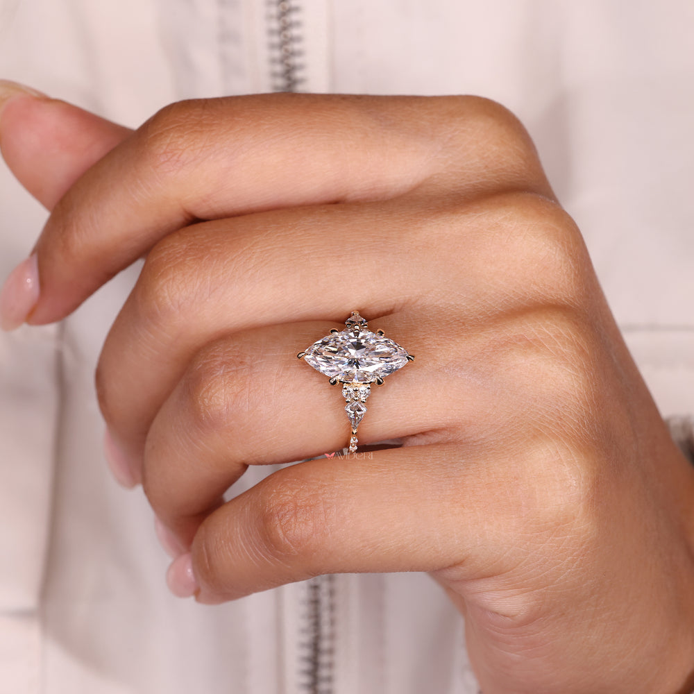 Handmade marquise diamond ring with muse setting and accents.

