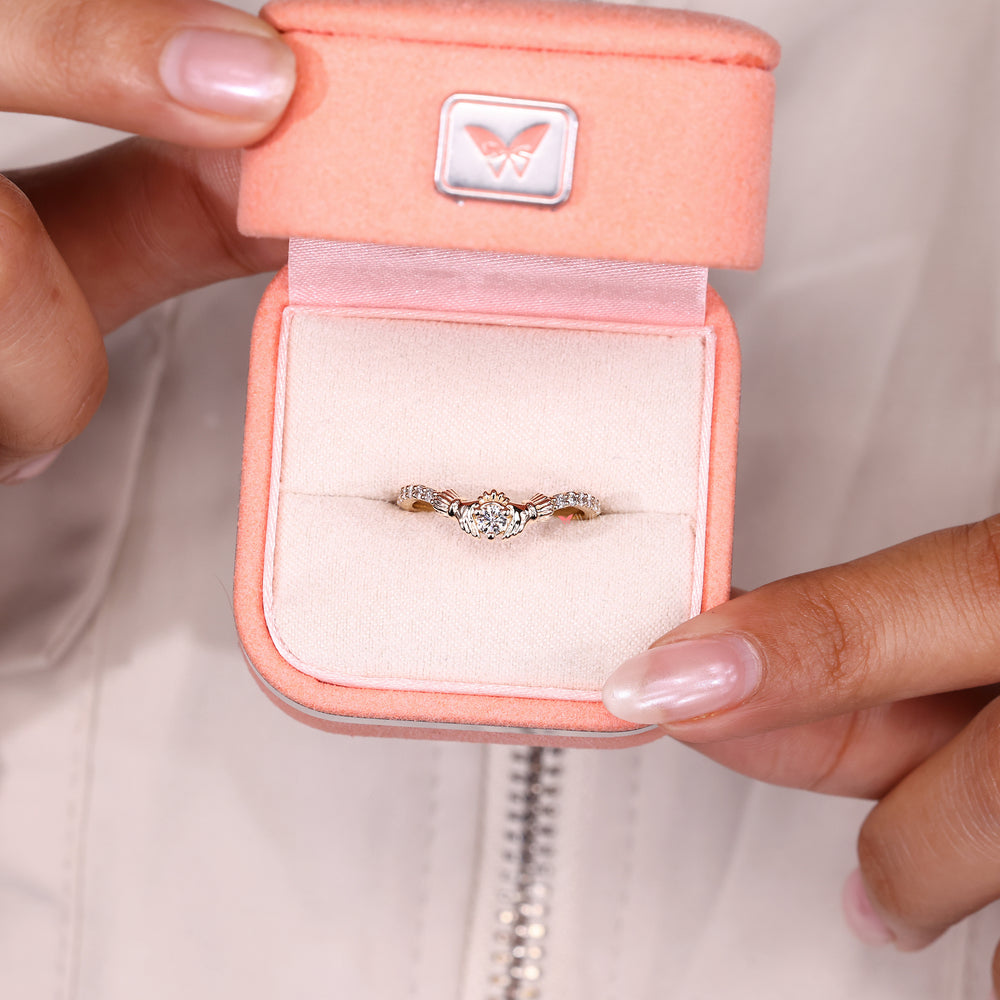 Claddagh style diamond ring with pave design.
