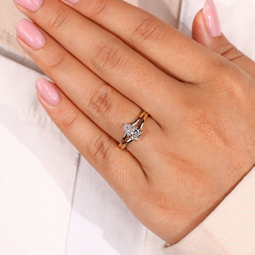 Avideri ring showcasing a pear shaped engagement ring with hidden halo, crafted with care and sustainable materials.