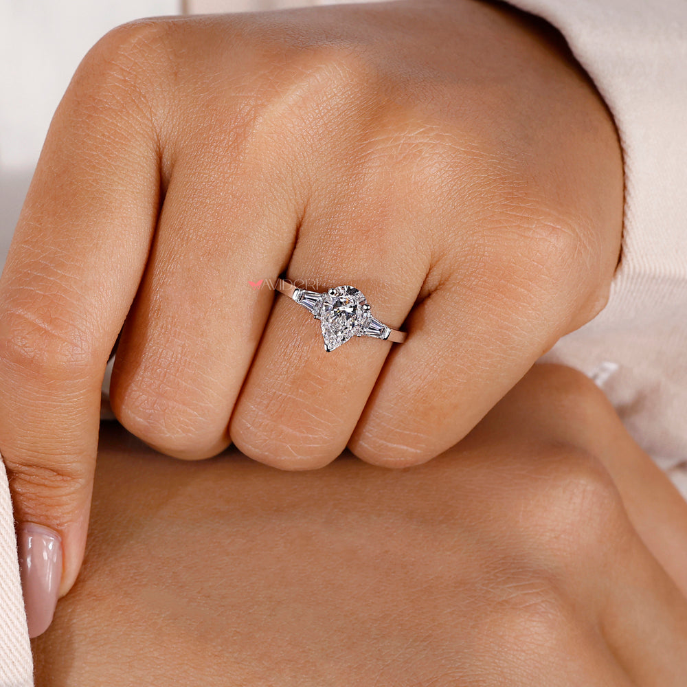 3 stone ring featuring a unique pear diamond design, perfect for creating meaningful moments and memories.
