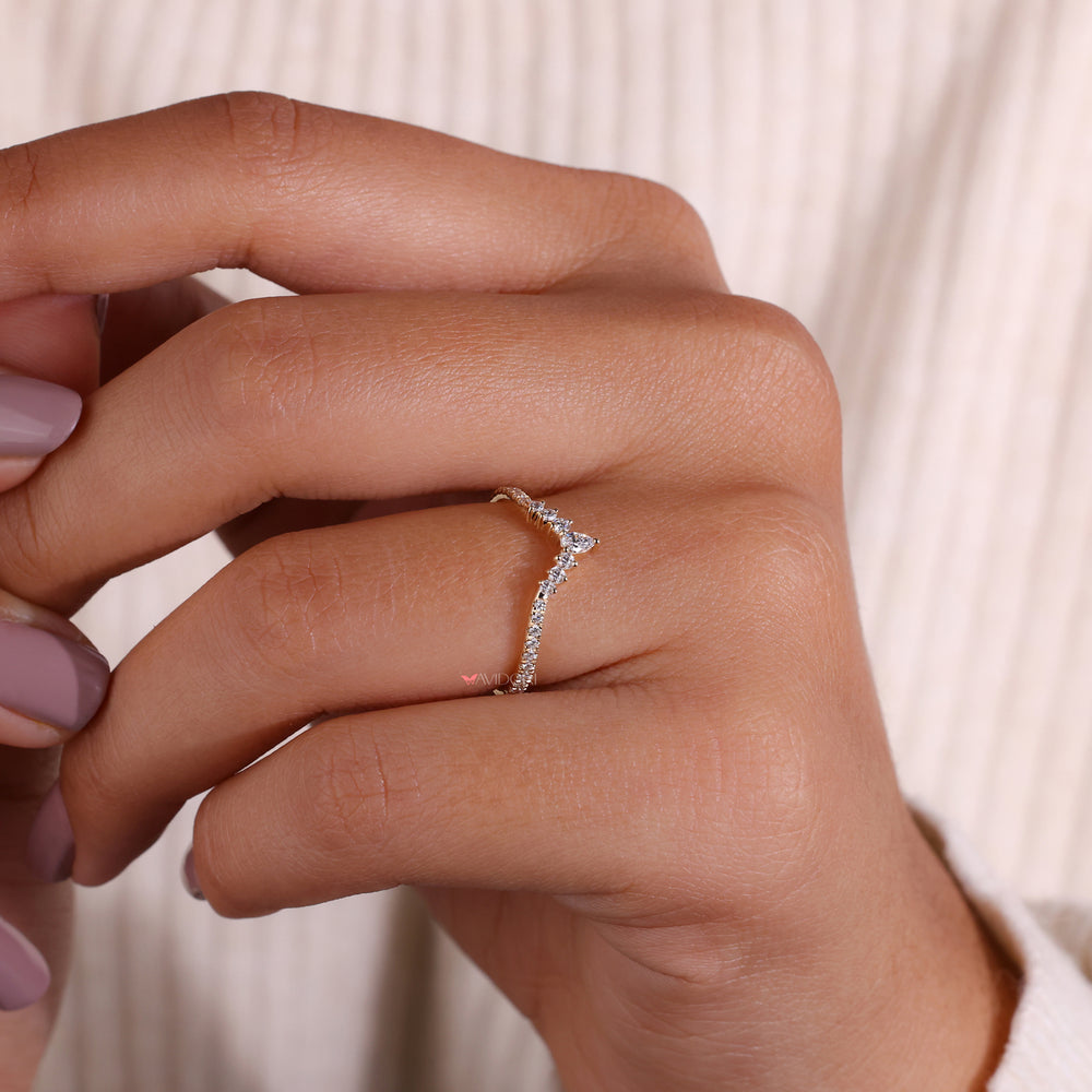 A sparkling round diamond wedding band that adds a touch of glamour to any jewelry collection with its classic design.
