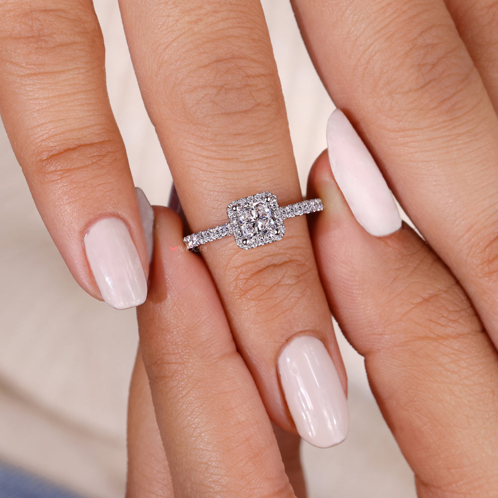 Engagement ring with pave detailing, creating an enchanting design with sparkling diamonds on the band for added elegance.
