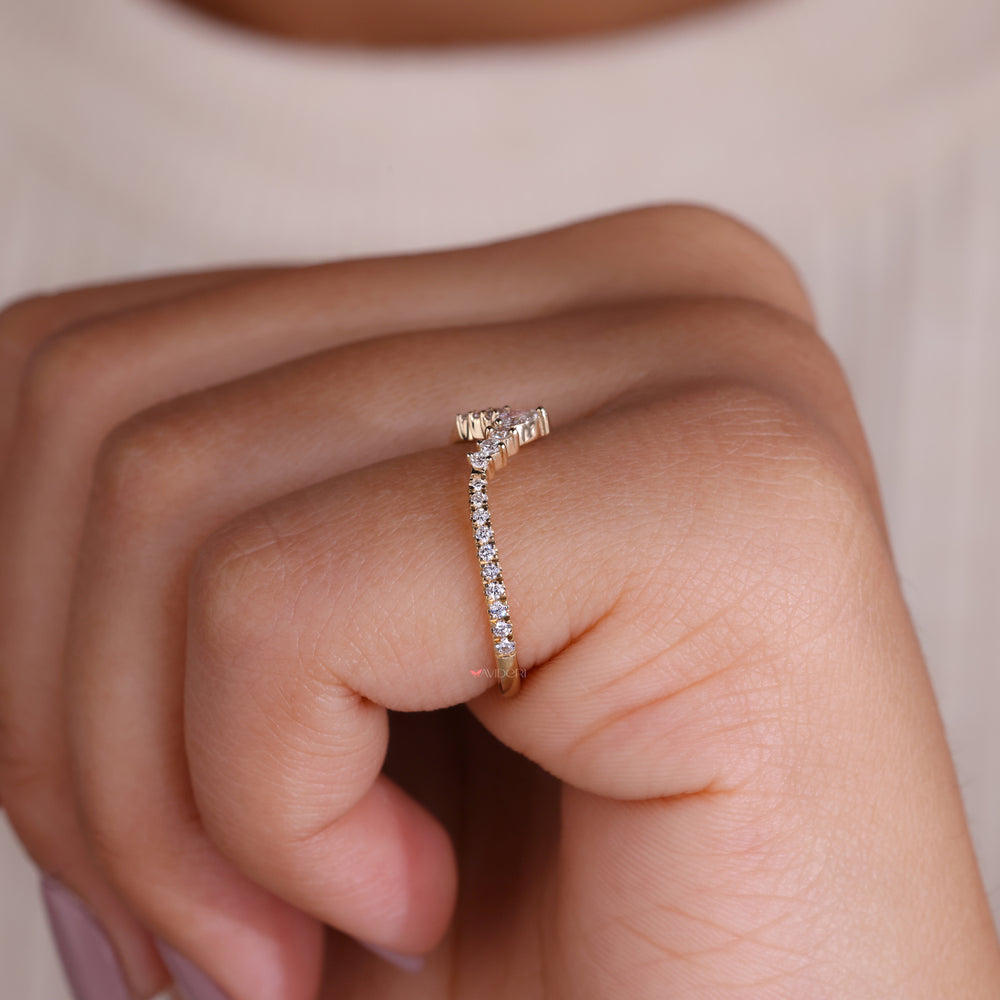 A stunning pear shaped wedding band set, featuring a harmonious pairing with a matching engagement ring for an unforgettable style.

