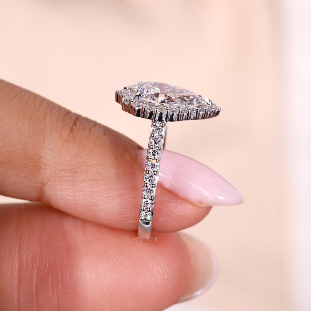 Round cut diamond ring set in a halo ring with dazzling pave details for extra shine.
