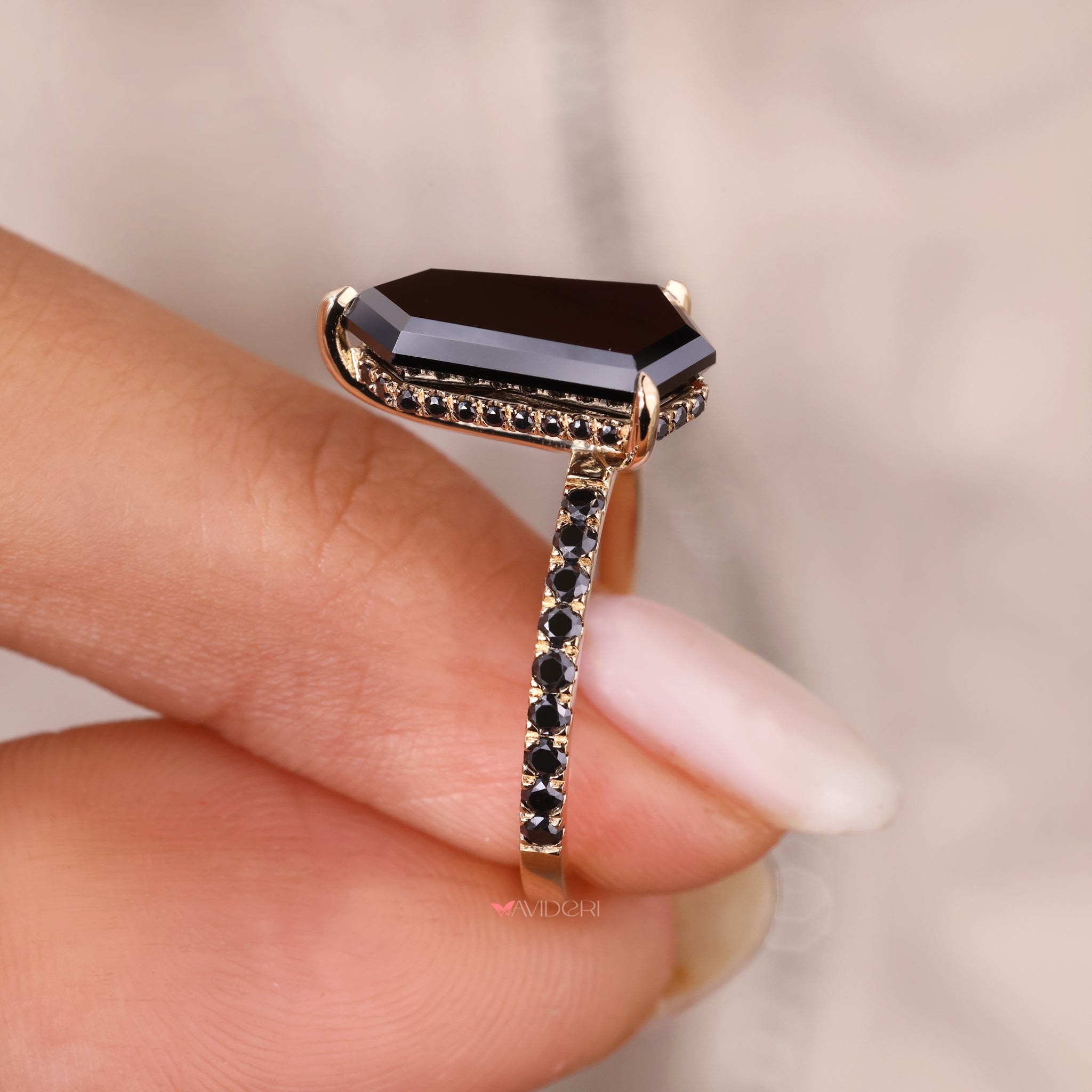 Claw prong setting on a handmade moissanite engagement ring.
