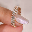 Three row pave wedding band with round cut stones.