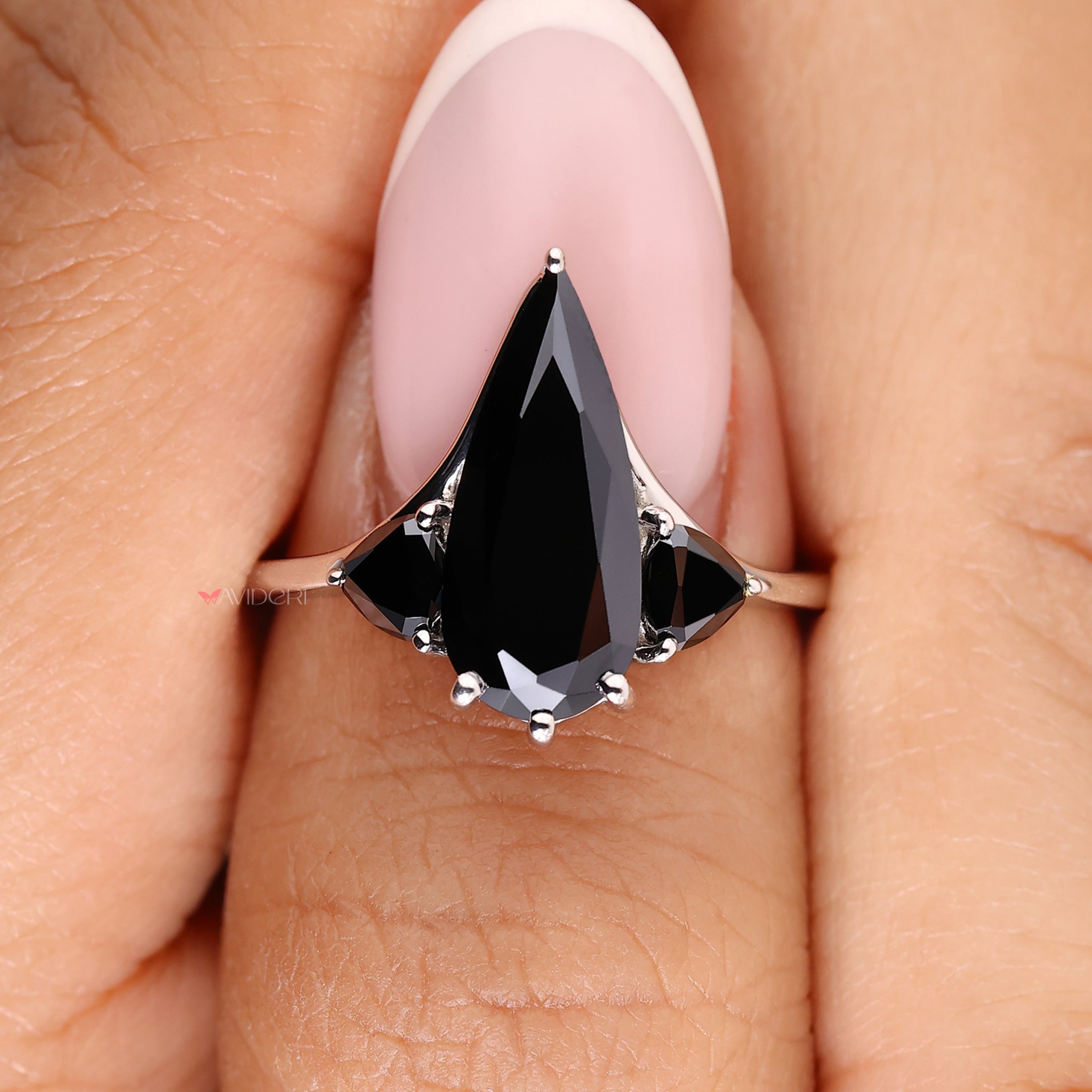 Avideri engagement ring showcasing a pear-cut moissanite center.