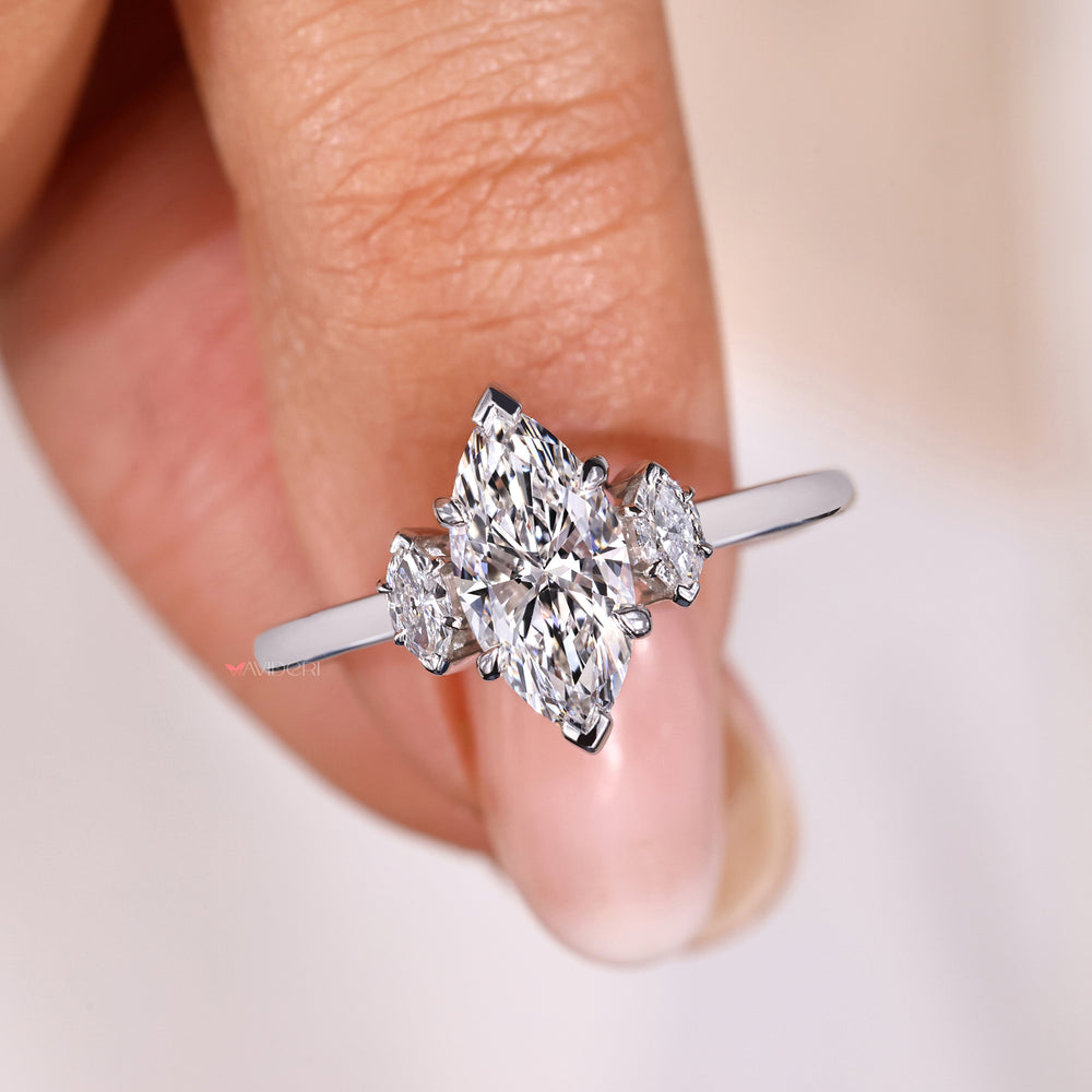 Marquise diamonds paired with three diamond ring settings, offering a luxurious yet versatile jewelry option.
