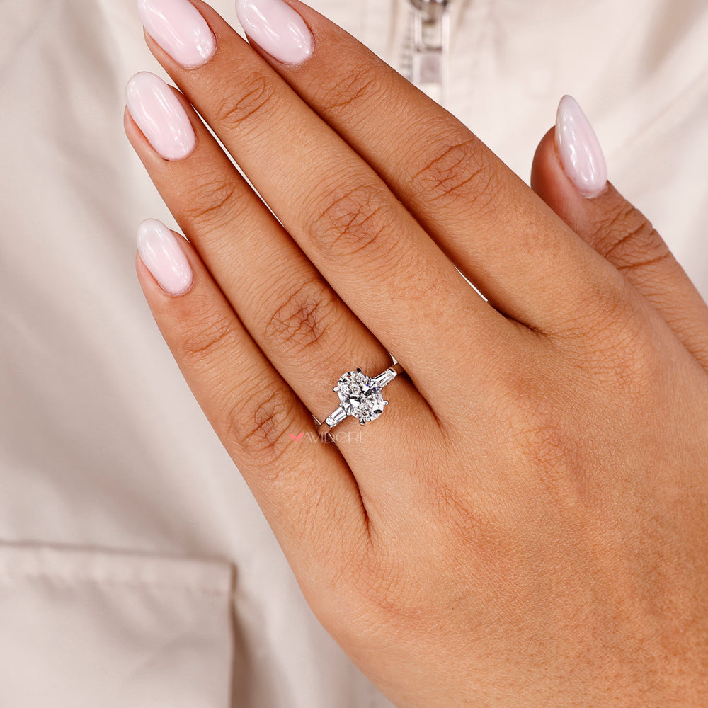 4 claw prong ring with an oval shaped diamond for secure brilliance.
