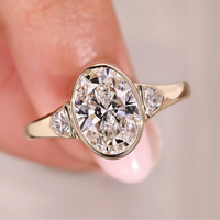 Three Stone Oval Engagement Ring In Yellow Gold