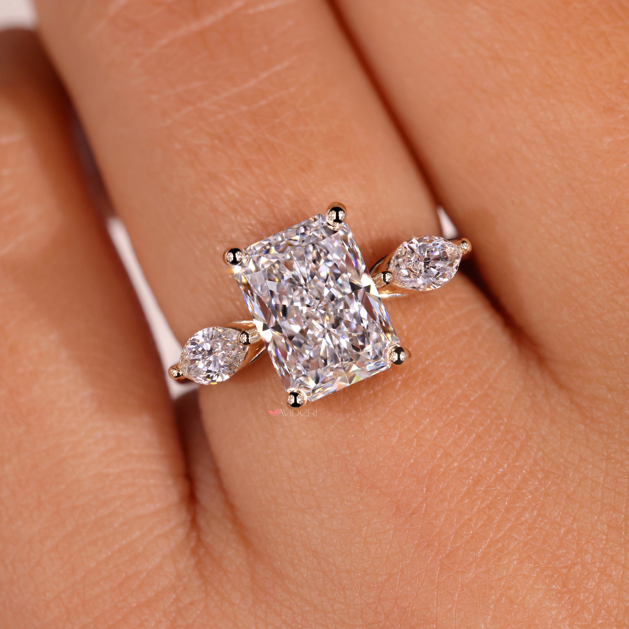 Avideri engagement ring crafted as a timeless three-stone piece.
