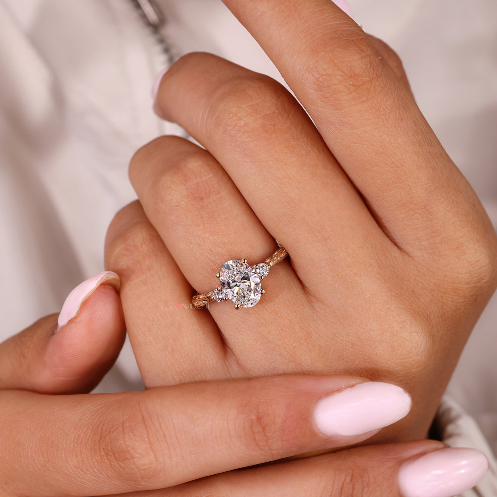 Oval cut diamond ring with four prongs and accents
