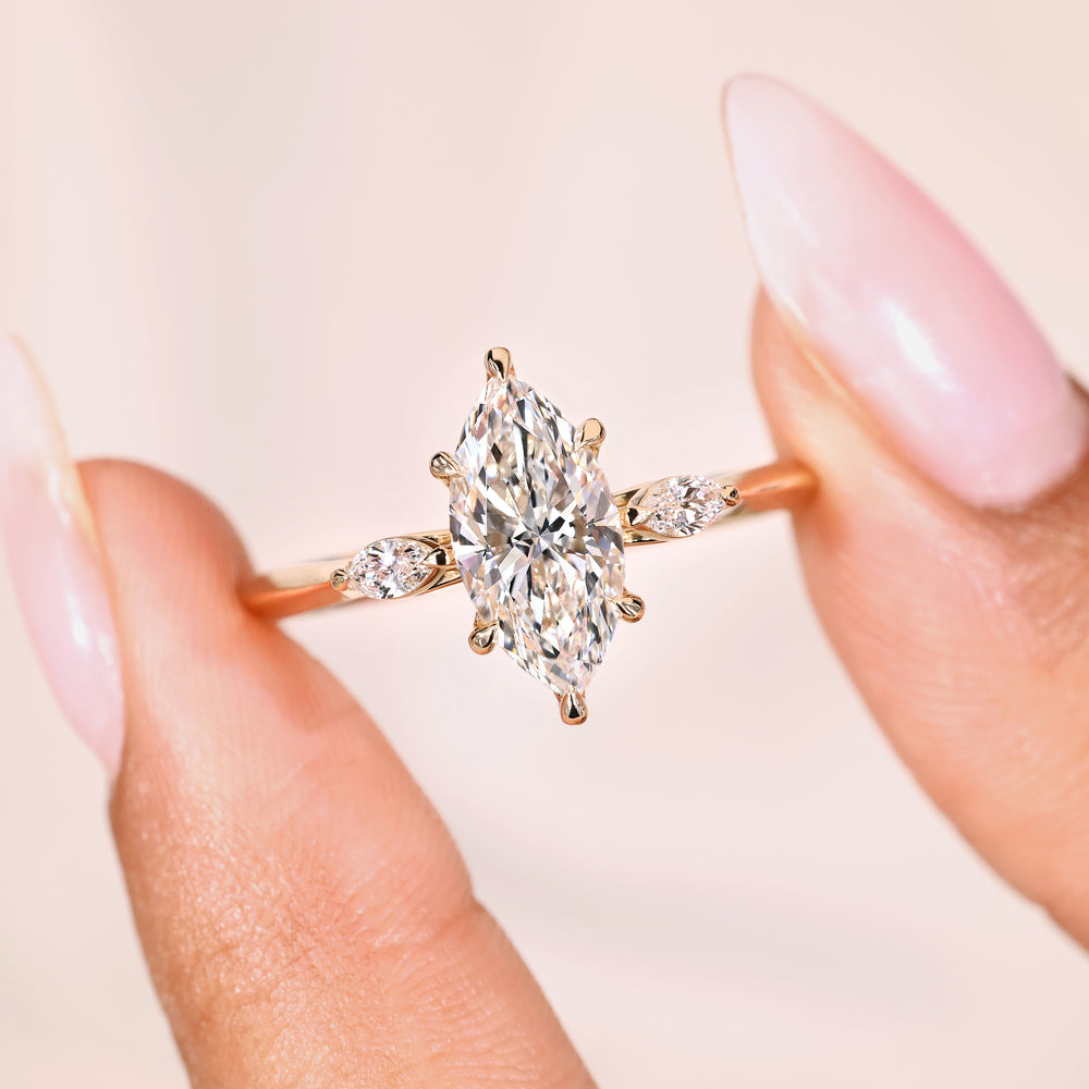 Three stone marquise diamond ring six claw prong.
