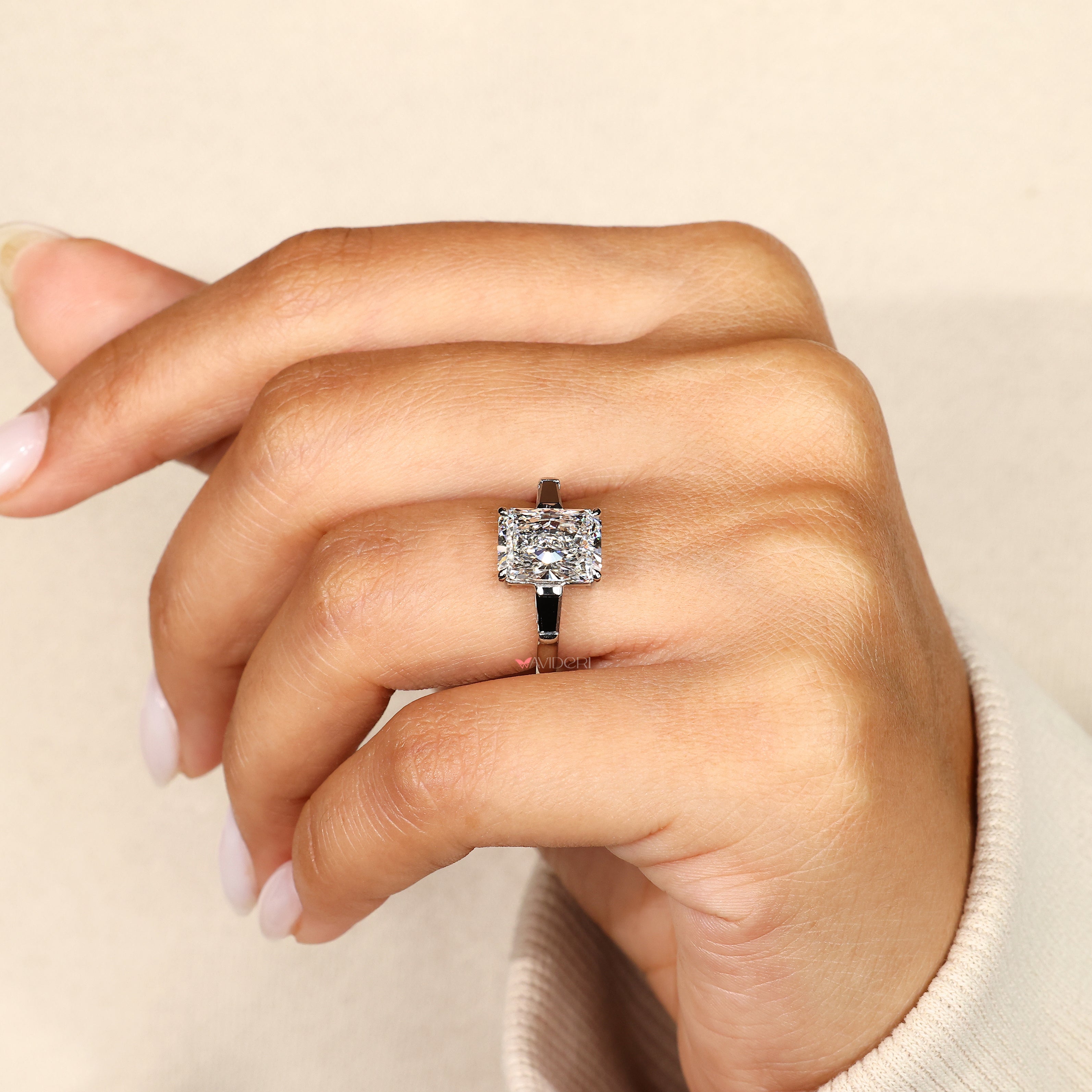 Claw prong radiant diamond ring with moissanite.
