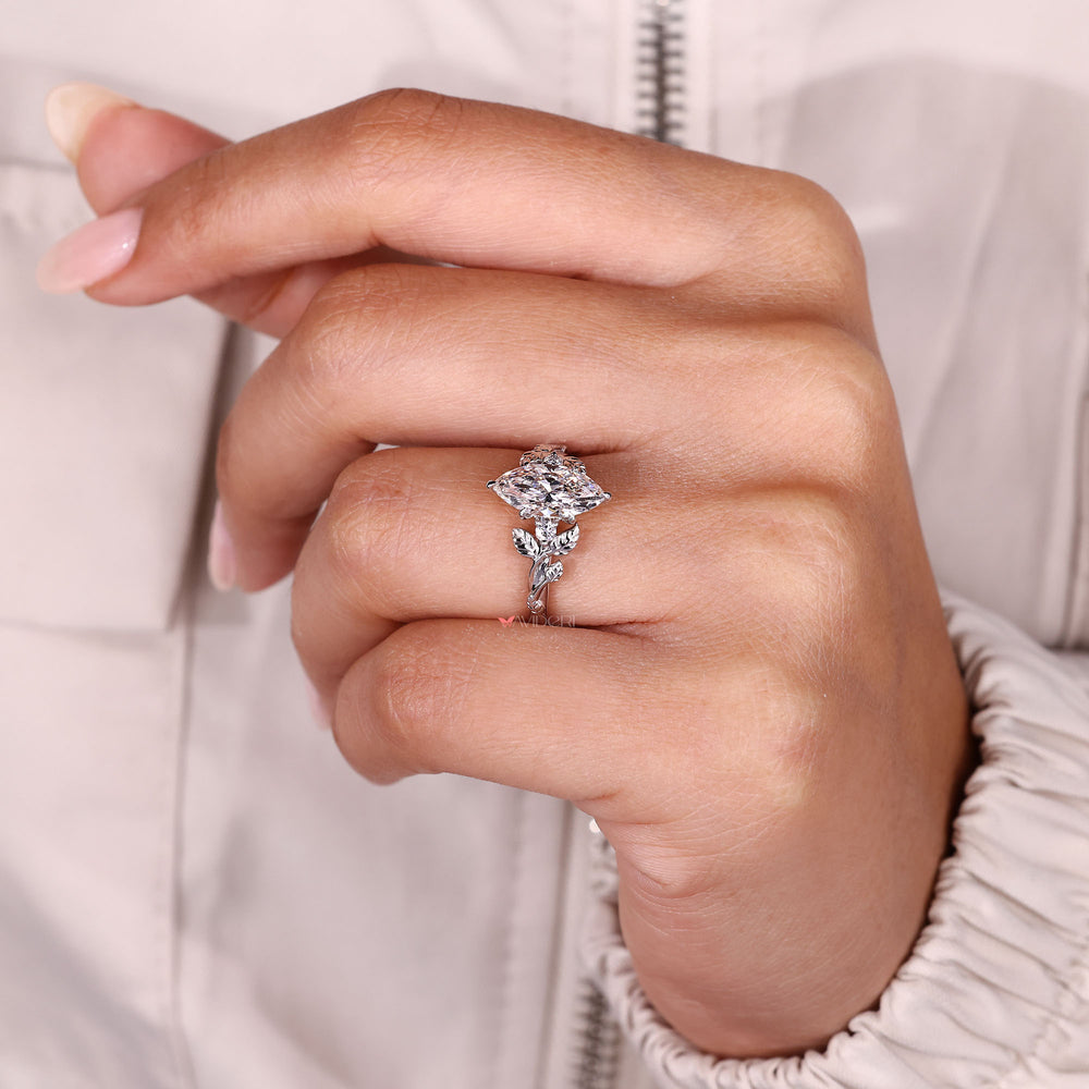 Marquise diamond ring with six prongs.
