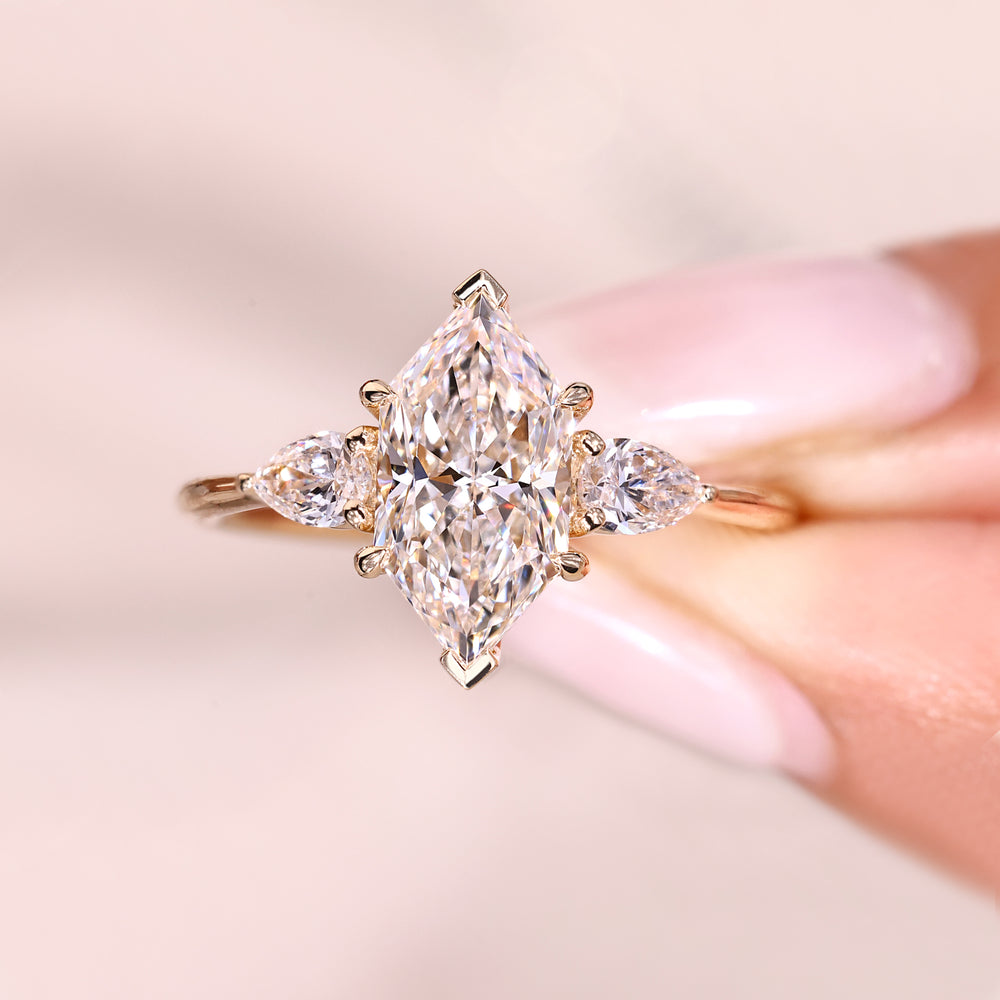 Elegant three stone dutch marquise diamond ring.
