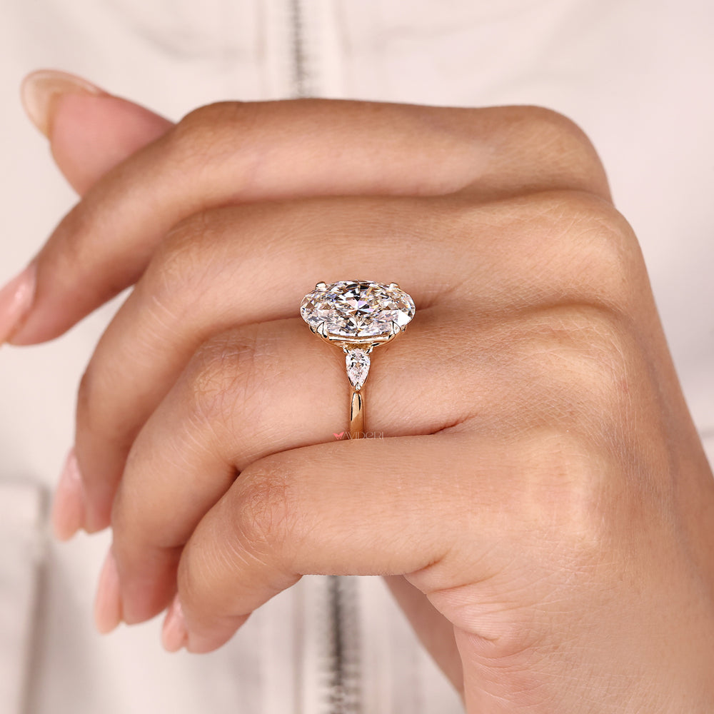 Oval diamond ring with four claw prong setting.
