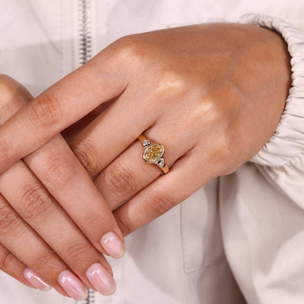 Handmade oval yellow diamond ring three stone.
