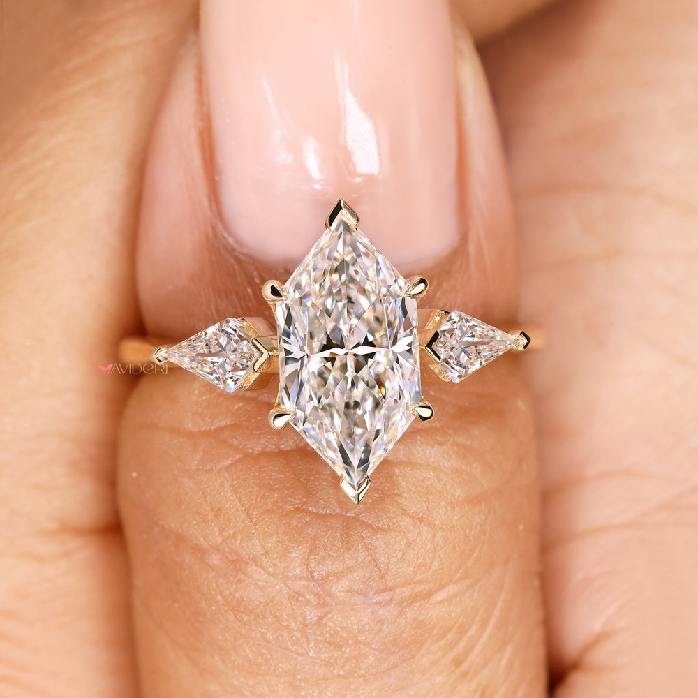 Handmade marquise diamond ring with kite cut side stone details
