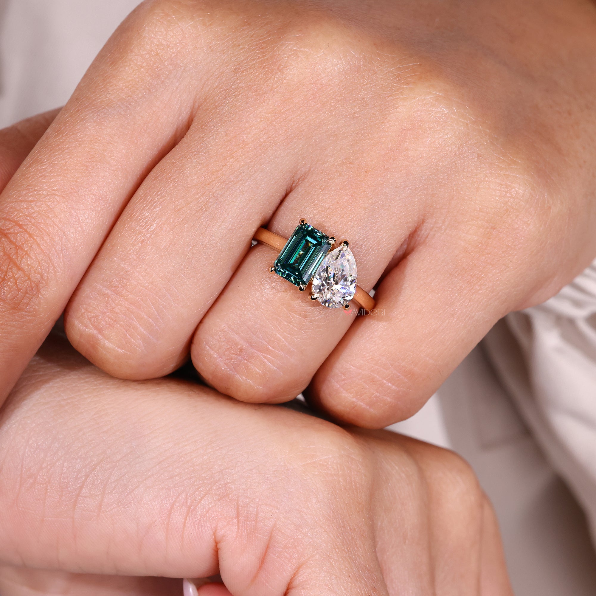 Handmade jewelry pear and emerald cut engagement ring.
