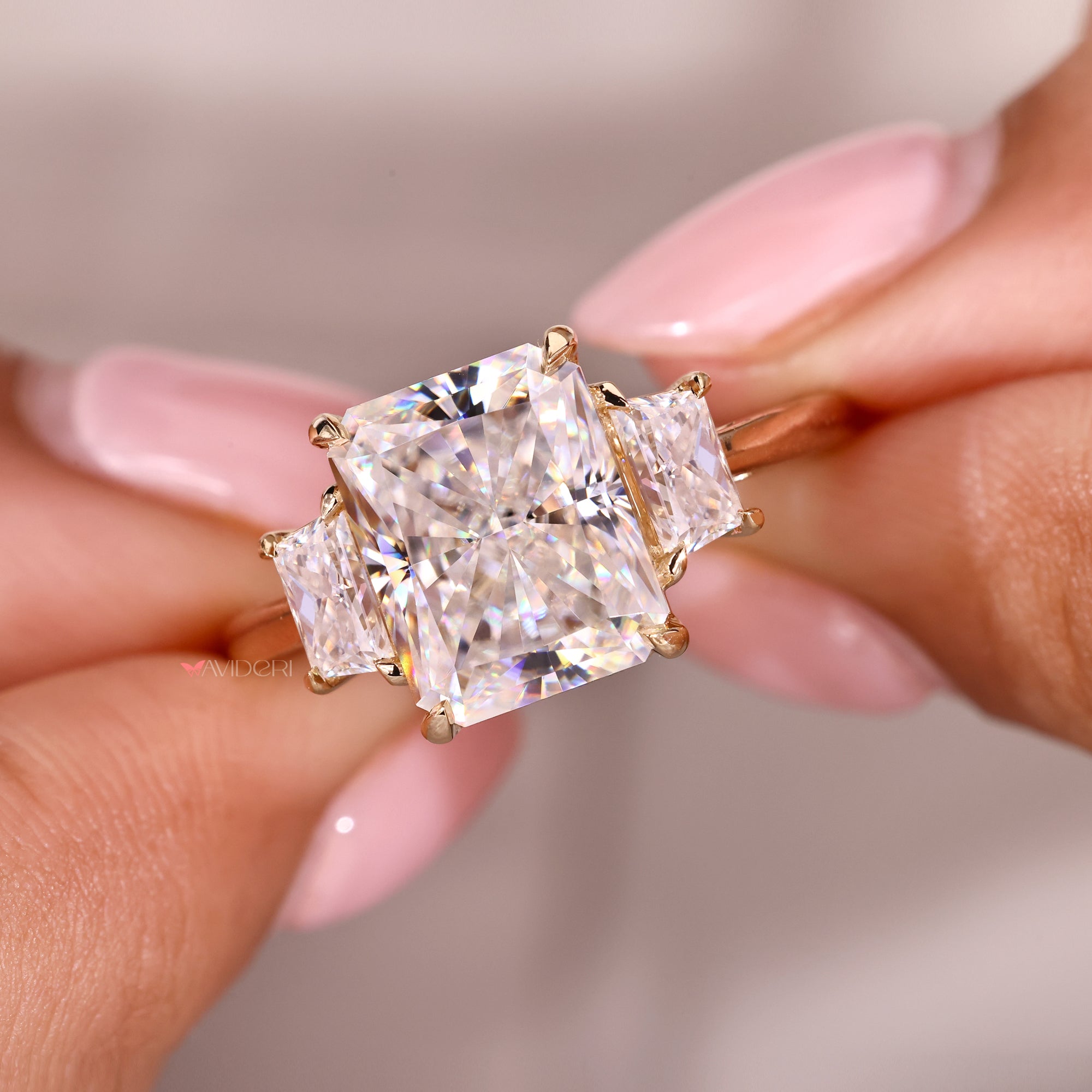 Avideri ring with three stone moissanite design.