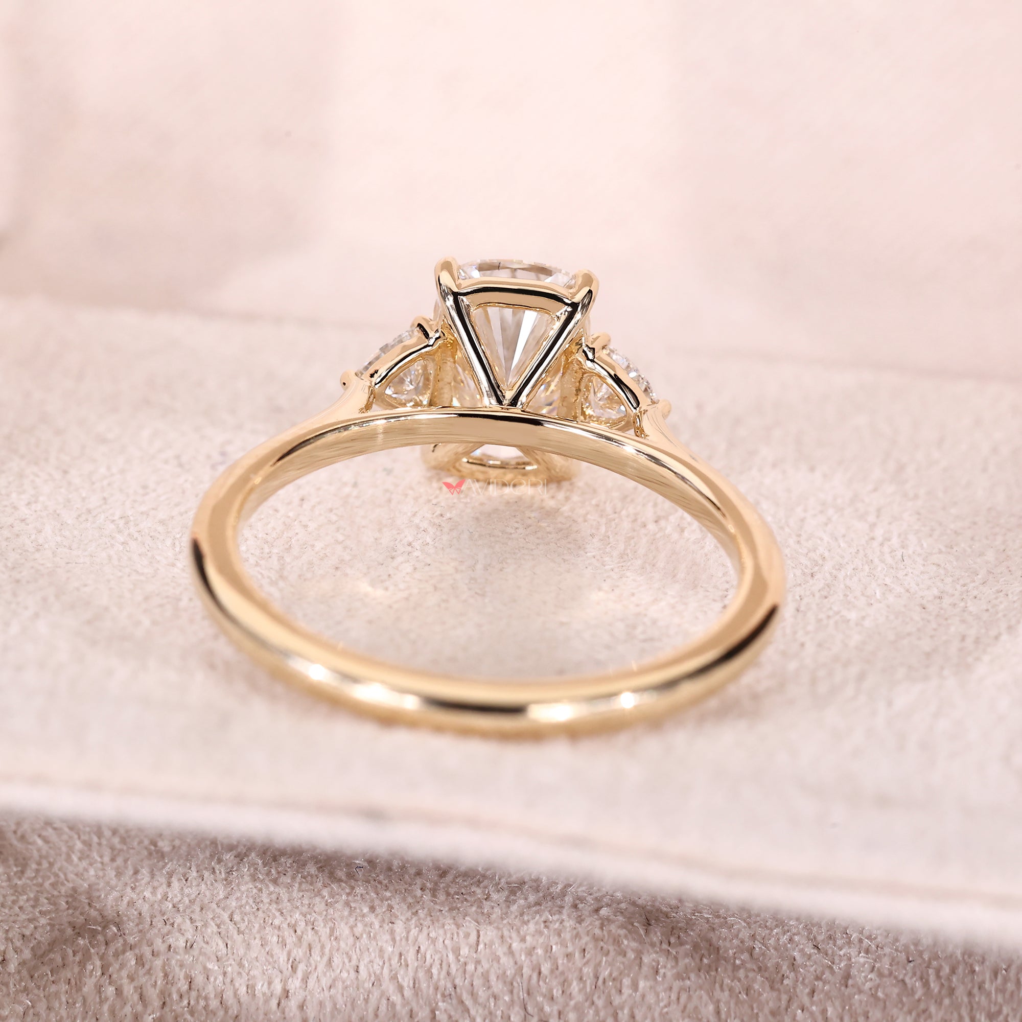 Custom yellow gold diamond ring with cushion cut.